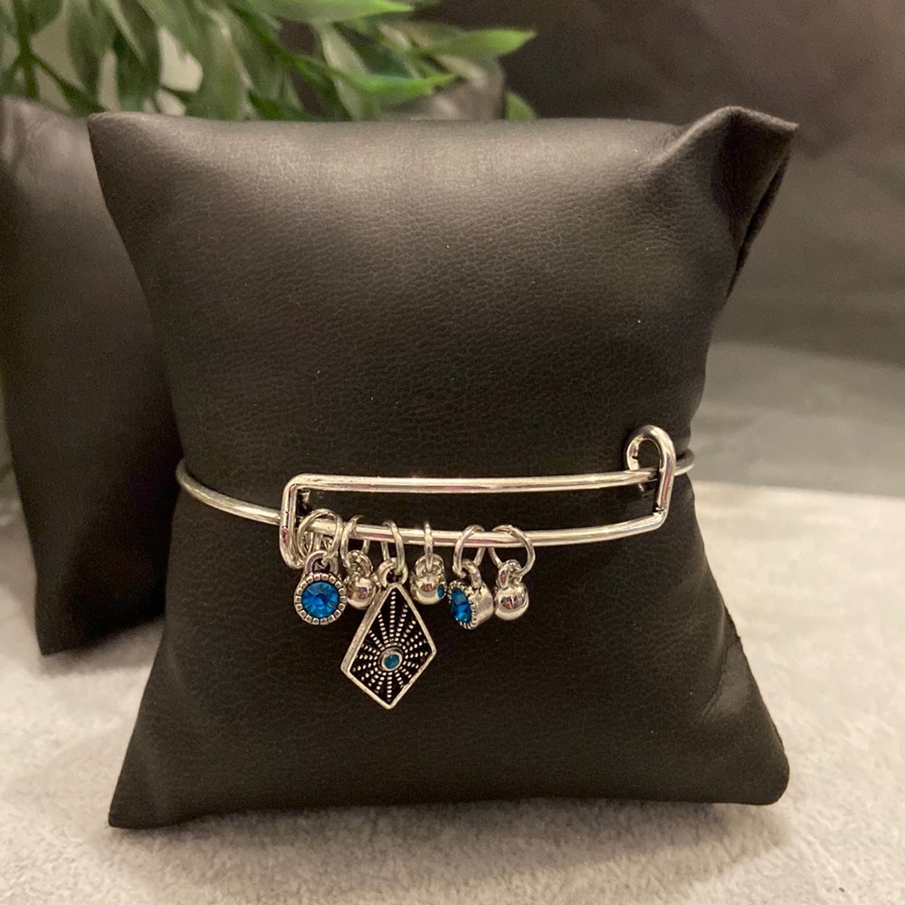 Silver slide bracelet with silver and blue gem charms. Never worn.